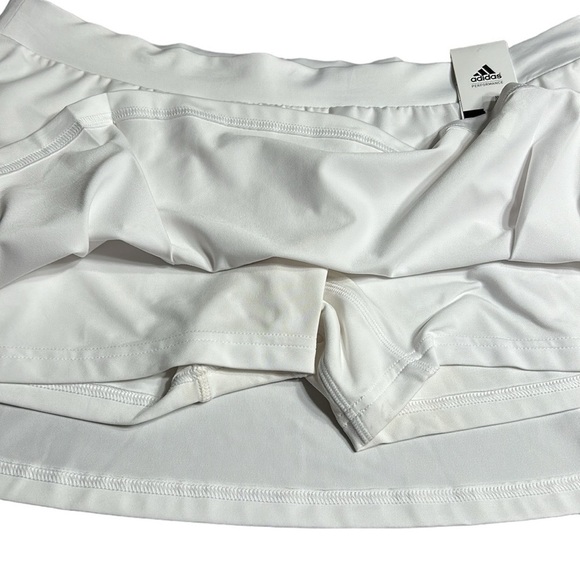ADIDAS white skort with pleats on the bottom  half . Then two horizontal bands. - Picture 4 of 11